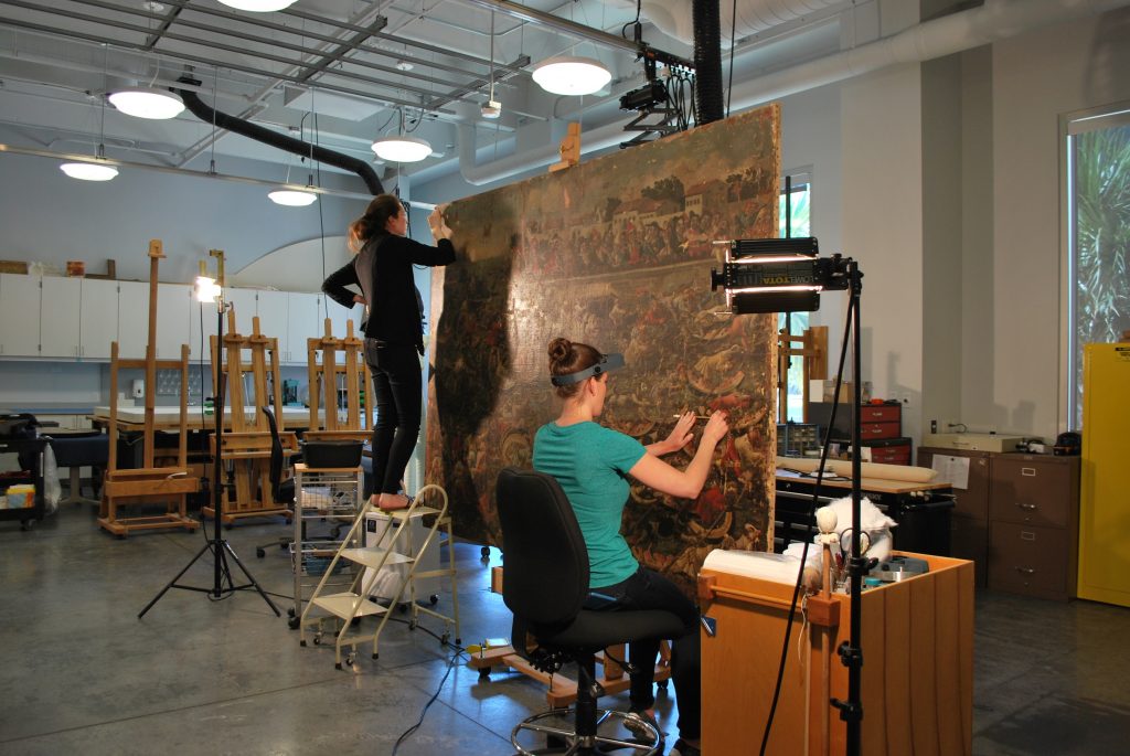 Conservators in the Laboratory at The Ringling working on Watermelon Regatta in 2016